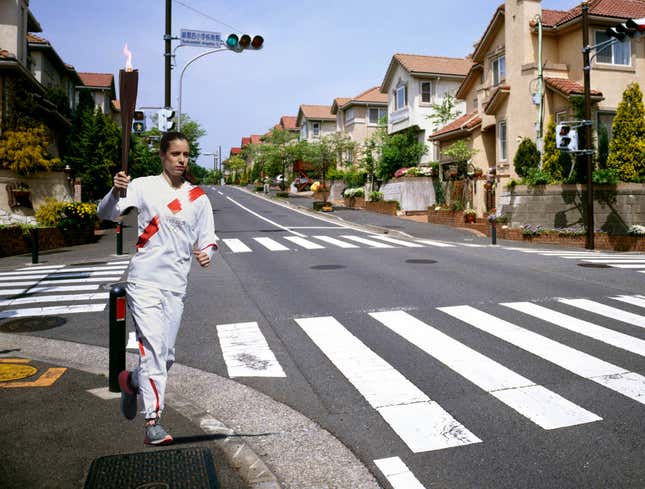 Image for article titled Olympic Torchbearer Has Been Jogging In Place On Street Corner For Past 2 Weeks