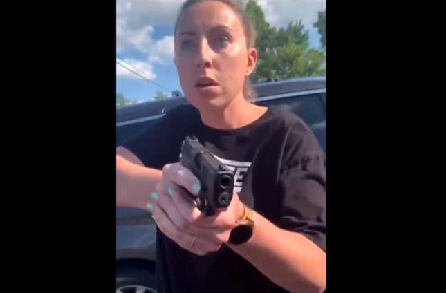 Image for article titled Video Shows White Woman Pulling a Gun on a Black Woman and Child After an Argument in a Detroit Parking Lot