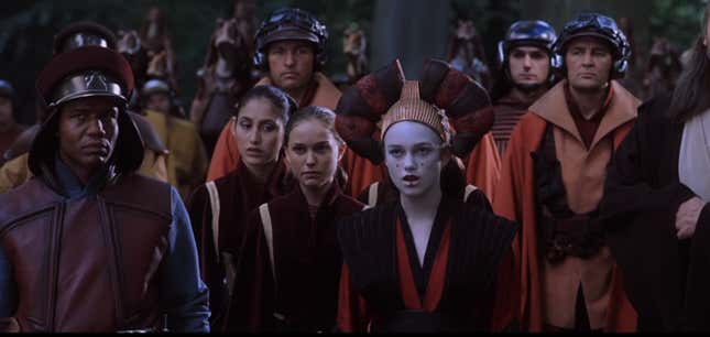 Okay, see the Naboo pilot standing tall and proud on the right of the photo? Now, see that pilot behind him and to his right? That’s Armitage.