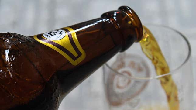 Beer pouring into glass from bottle
