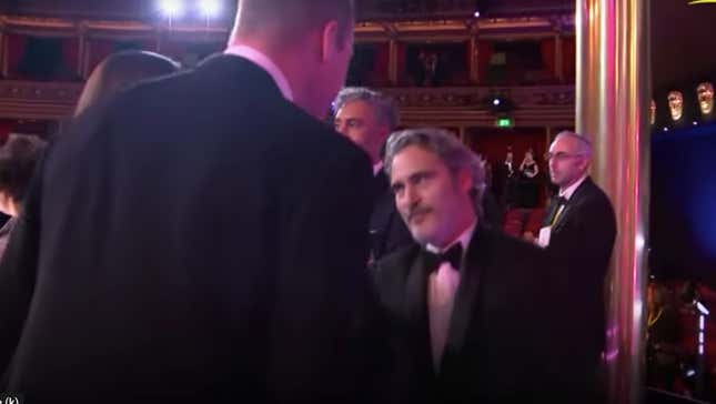 Image for article titled Joaquin Phoenix Curtsying to Prince William Is an Instant Classic
