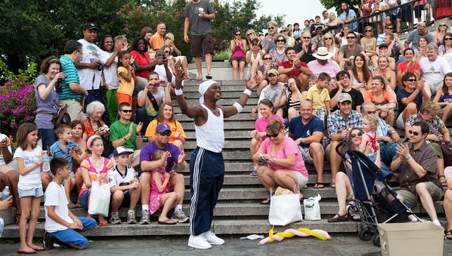 Image for article titled Nation’s Tourists Announce Plans To Form Circle, Clap Hands Around Guys Doing Flips And Stuff