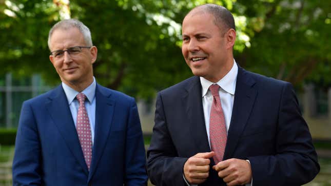 Australian Treasurer Josh Frydenberg (right) and the Minister for Communications Paul Fletcher in the Senate Courtyard at Parliament House on February 23, 2021 in Canberra, Australia.