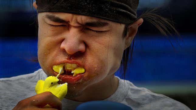 Man grimacing with a mouthful of Peeps