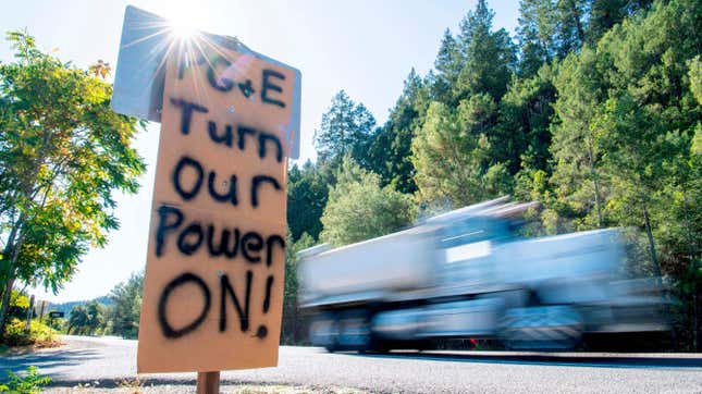 A sign calling for PG&amp;E to turn the power back on is seen on the side of the road during a statewide blackout in Calistoga, California, on October, 10, 2019.