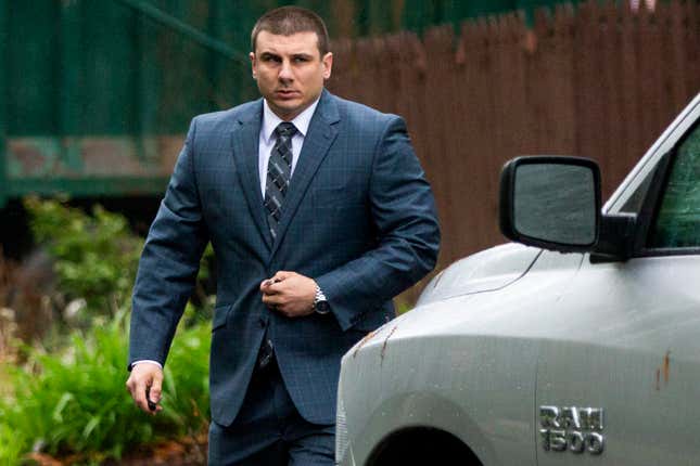 New York City cop Daniel Pantaleo leaves his house May 13, 2019, in Staten Island, N.Y., as his long-delayed disciplinary trial in the death of Eric Garner is set to begin.