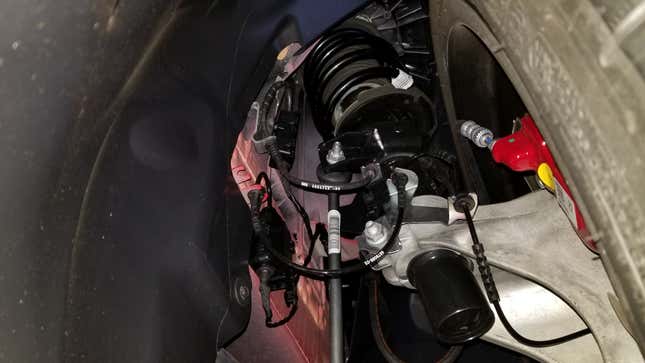 Toyota Supra double-joint spring strut front suspension as viewed from below and in the rear