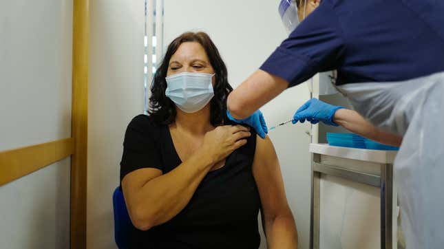 Deborah Cartmel receives the Covid-19 vaccine as the Royal Cornwall Hospital begin their vaccination program on December 9, 2020 in Truro, United Kingdom