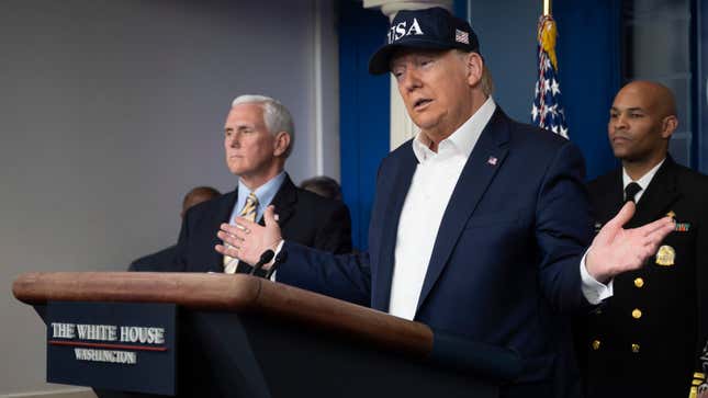 President Donald Trump, surrounded by members of the White House’s coronavirus task force, discusses the national emergency at a Saturday press conference.