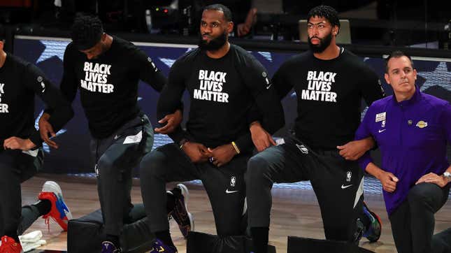 LeBron James and Anthony Davis kneel with teammates before the 2020 NBA Finals.