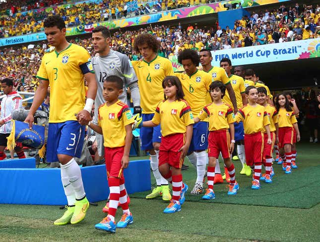 Image for article titled Report: Probably Some Reason Soccer Players Entering Stadium With Small Children