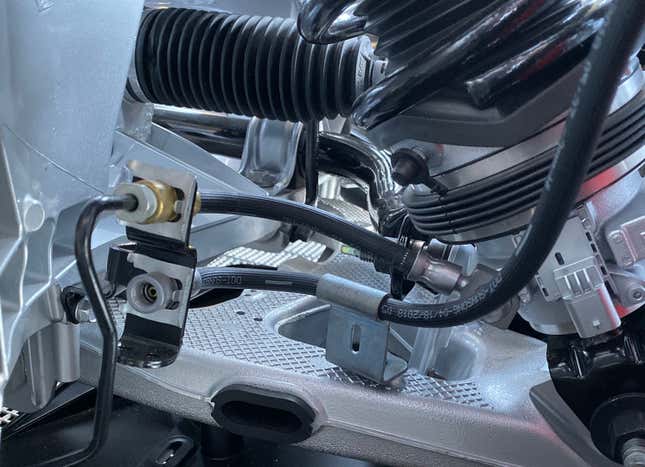 Hydraulic line entering damper
