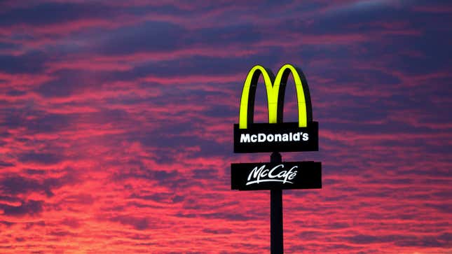 McDonald's sign surrounded by dramatic sunset