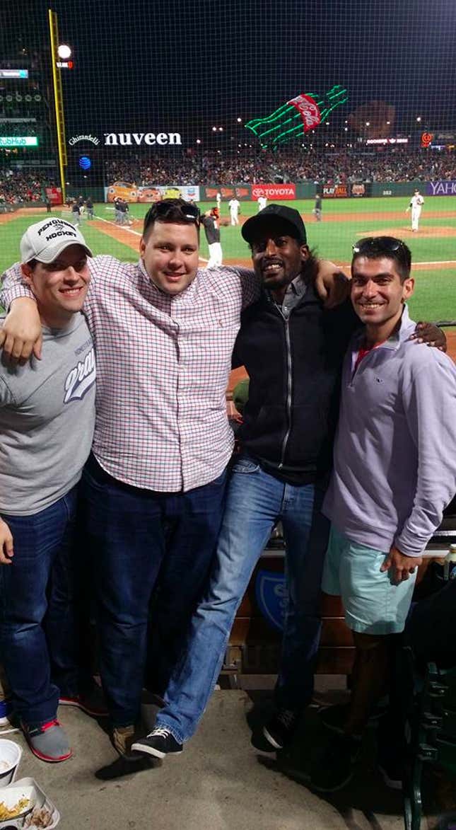 Mo Norai with “Eric Williams”, center, at a Giants game in June, along with two men who said they were DoJ lawyers