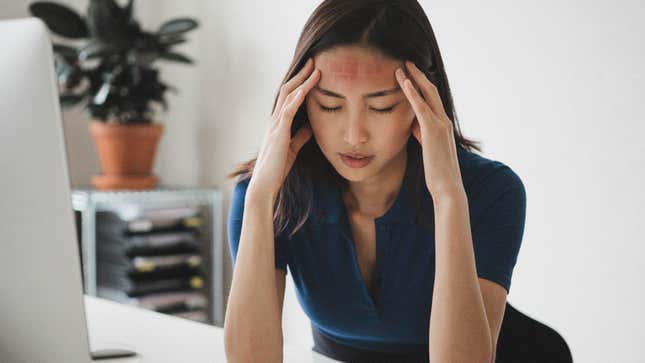 Image for article titled Embarrassed Woman Hopes Coworkers Didn’t Catch Her Bashing Forehead Into Keyboard