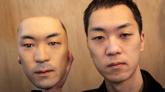 Shuhei Okawara, owner of mask shop Kamenya Omote, holding a hyper-realistic face mask poses for a portrait on January 28, 2021 in Tokyo, Japan. 