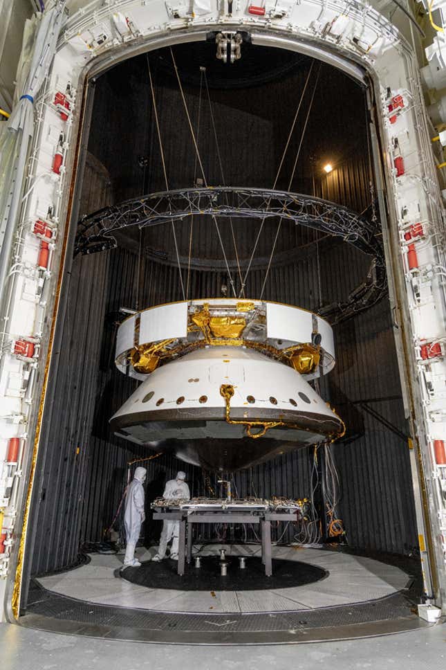 A picture of the assembled spacecraft next to people to give you a sense of the scale.