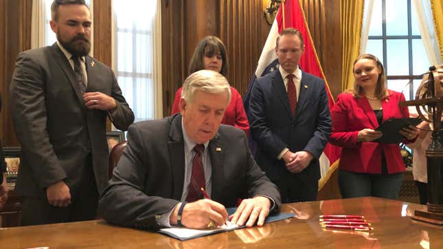Missouri Republican Governor Mike Parson signing an eight-week abortion ban on May 24, 2019.
