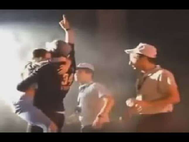 Here Is A Fan Clinging to Enrique Iglesias