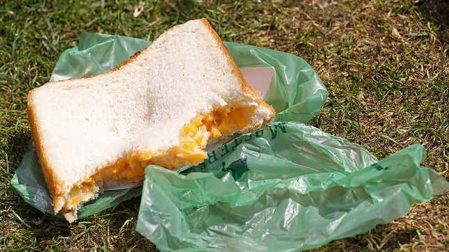 One of Augusta National's famed pimento cheese sandwiches resting on a green wrapper