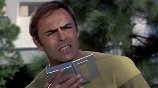 John Saxon as Dylan Hunt, reporting from the 22nd century in Planet Earth.