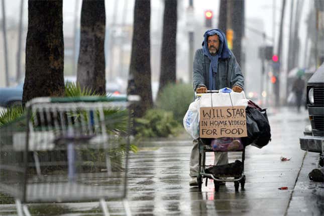 Mel Gibson begs for work on Wilshire Boulevard in Los Angeles.