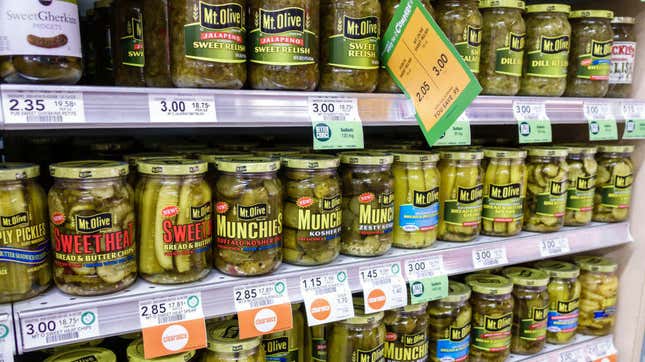 Rows of pickle jars at supermarket