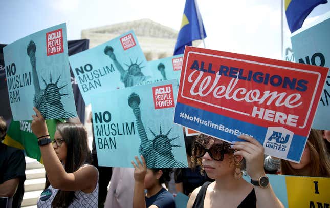 WASHINGTON, DC - JUNE 26: Protesters gather outside the U.S. Supreme Court as the court issued an immigration ruling June 26, 2018 in Washington, DC. The court issued a 5-4 ruling upholding the Trump administration’s policy imposing limits on travel from several primarily Muslim nations. 