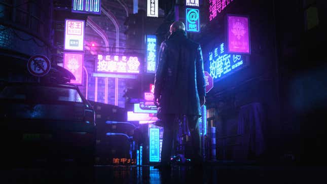 Agent 47 wearing a car coat and standing in Chonqging in the rain in Hitman 3, one of the best games of 2021.