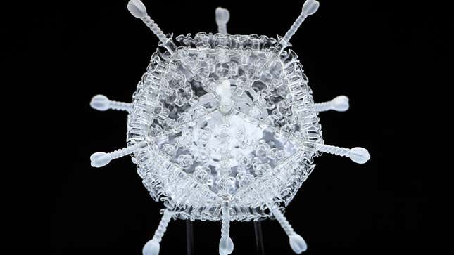 Image for article titled This Glass Sculpture of the AstraZeneca Coronavirus Vaccine Is 1 Million Times Larger Than the Real Thing