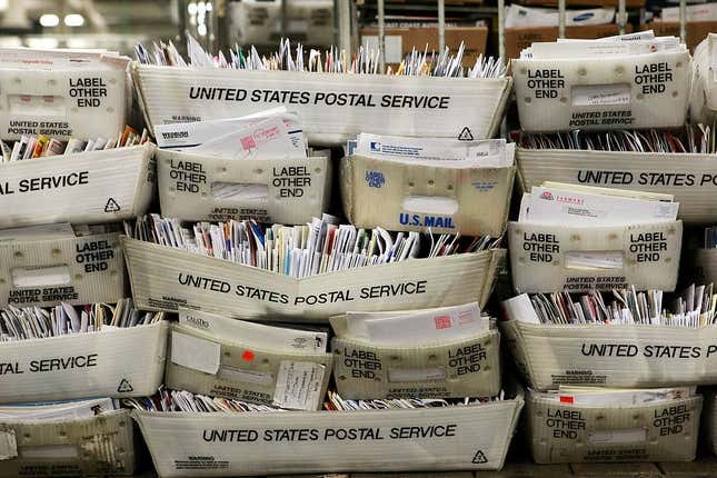 Stacks of boxes holding cards and letters are seen at the U.S. Post Office sort center on December 15, 2008, in San Francisco, California. On its busiest day of the year, the U.S. Postal Service is expecting to process and mail over one billion cards, letters, and packages. 