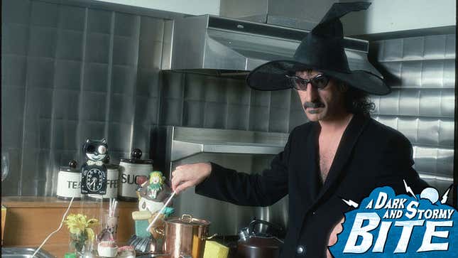 Frank Zappa stirring ingredients in a kitchen, wearing sunglasses and black witch hat