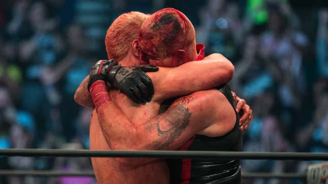 Cody Rhodes embraces his hemorrhaging brother, Dustin, after their show-stealing match at AEW’s inaugural event, Double or Nothing.