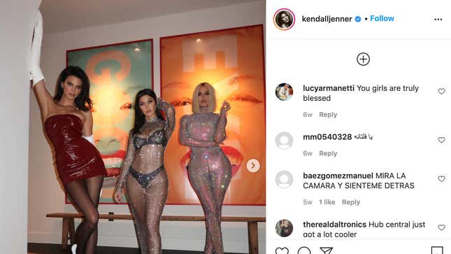 Kendall, Kourtney, and Khloe in front of a pair of Barbara Kruger pieces