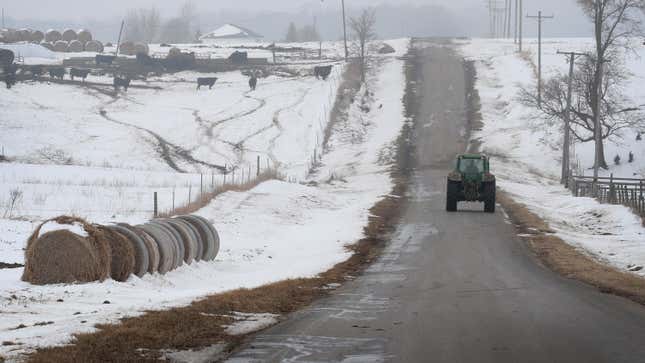 A farmer drives a tractor down a rural road on Jan. 17, 2019 near Ottawa, Ill.