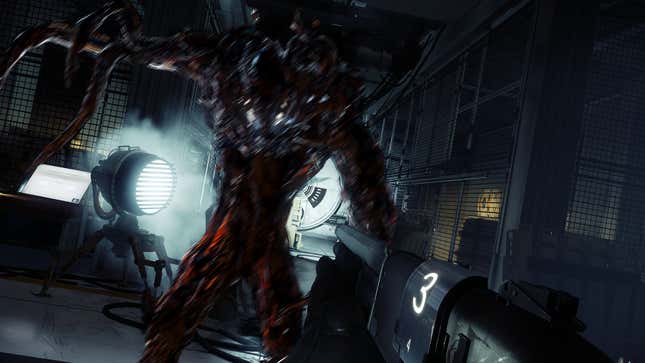 A first-person perspective shows a player holding a gun with a live ammo count in front of a shadowy alien who's ready to strike.