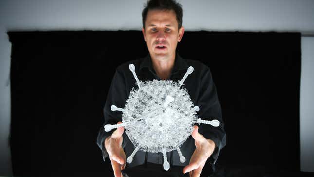 Image for article titled This Glass Sculpture of the AstraZeneca Coronavirus Vaccine Is 1 Million Times Larger Than the Real Thing