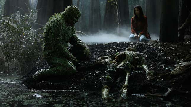 Swamp Thing and Abby Arcane staring at Alec Holland’s skeleton.