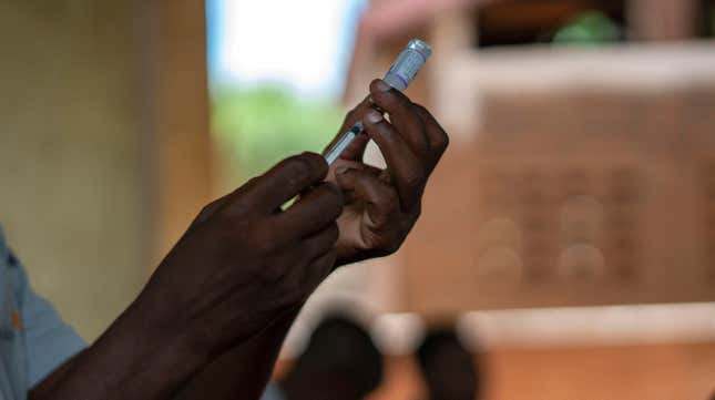 Health officials prepare to vaccinate residents of the Malawi village of Tomali, where young children are test subjects for the world’s first vaccine against malaria.