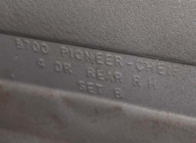 Text found under the armrest that screws to Brian’s 1996 Jeep Cherokee’s rear passenger-side door panel.