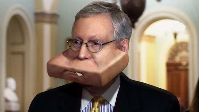 Image for article titled Panicking Mitch McConnell Shoves Entire Senate Healthcare Bill Into Mouth As Democrat Walks Past