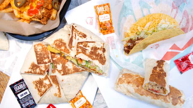 Array of Taco Bell foods and sauces on wrappers