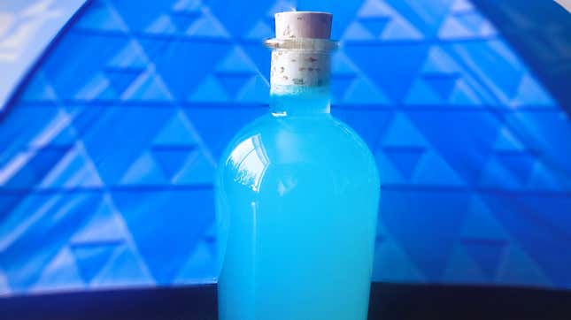 Bright blue cocktail in stoppered bottle