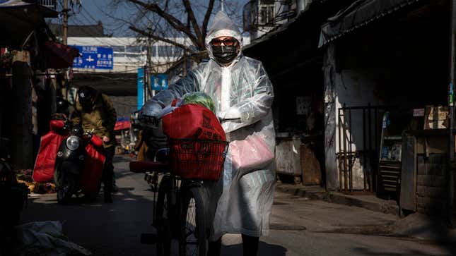 A woman in Wuhan, the provincial capital where the virus was first detected, goes out on Feb. 9.