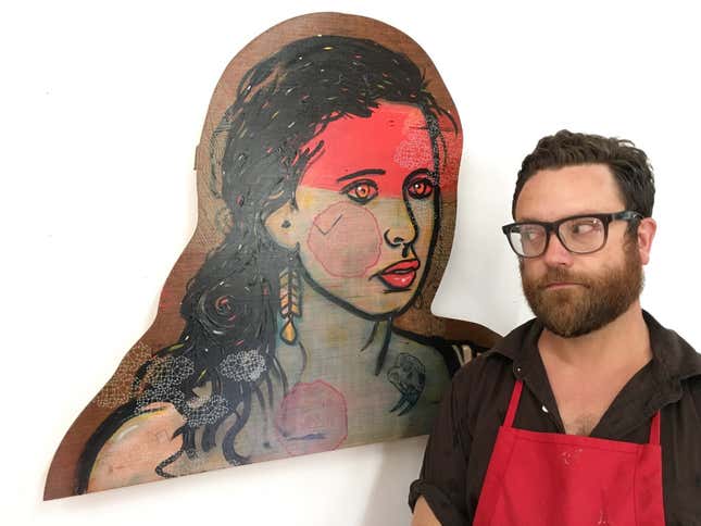 Artist Andy Herod with one of the portraits inspired by a People You May Know suggestion he received on Facebook