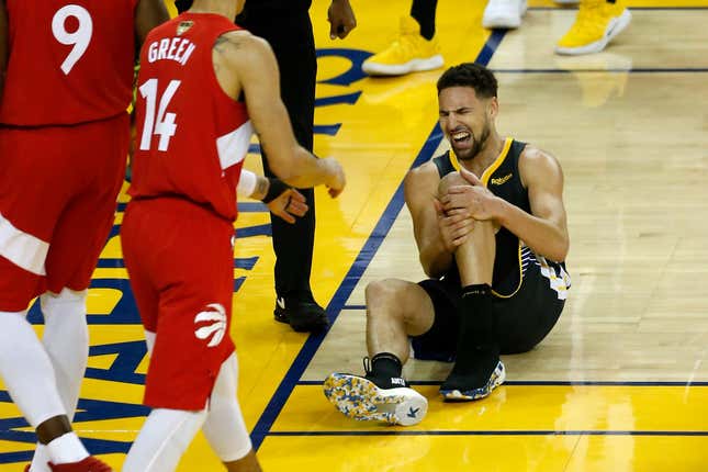 Klay Thompson of the Golden State Warriors reacts after hurting his leg in the second half during Game Six of the 2019 NBA Finals against the Toronto Raptors on June 13, 2019 in Oakland, Calif.