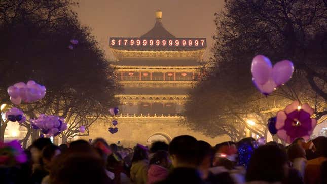 Image for article titled Chinese Citizens Gather In Beijing Square To Watch U.S. National Debt Clock Strike $18 Trillion