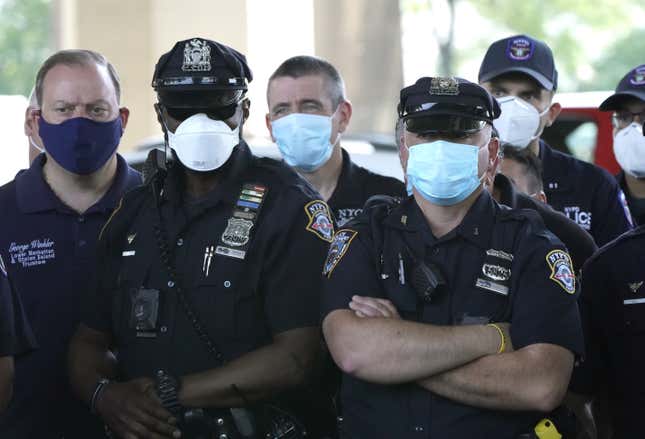 NYPD Police officers listen as Police Benevolent Association of the City of New York President Pat Lynch and representatives from other NYPD and law enforcement unions holds a news conference on June 9, 2020 to address the “current anti-law enforcement environment.” 