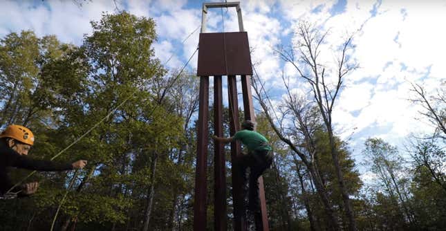 An unidentified climber scales the replica.