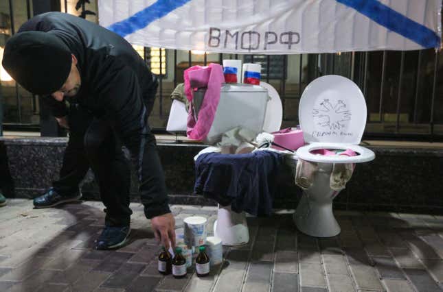 Ukrainian activists bring what they called as Humanitarian aid for Russians during the prank rally in front of the Russian embassy in Kyiv, Ukraine, 25 November 2019.